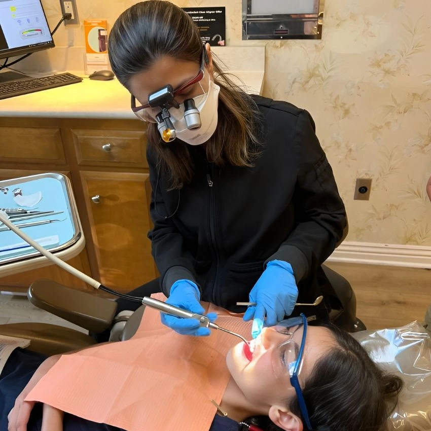 Our top dentist in Tustin checking patients oral health